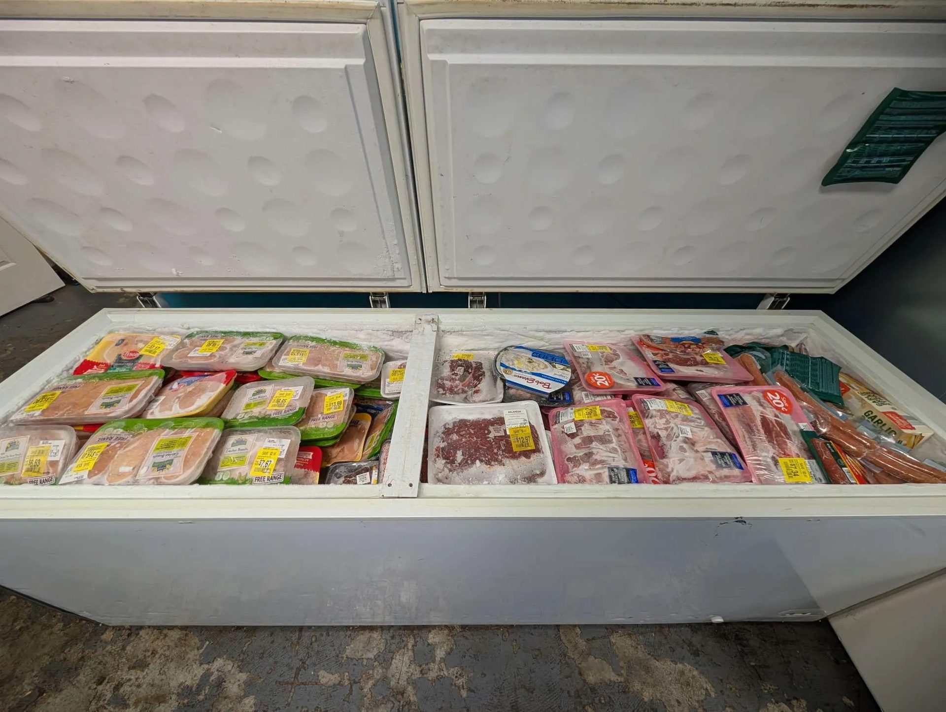 Chest freezers filled with packaged meat and poultry